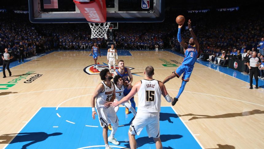 Oklahoma City Thunder guard Shai Gilgeous-Alexander shoots against the Denver Nuggets Sunday in Oklahoma City, Oklahoma.