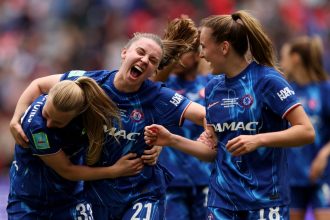 Agnes Beever-Jones, Niamh Charles and Wieke Kaptein celebrate Chelsea's sixth FA Cup title.