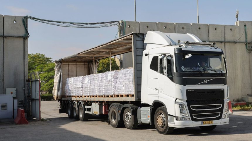 A truck carrying humanitarian aid drives through the Kerem Shalom crossing between southern Israel and the Gaza Strip, on May 22, 2025. The UN said on May 21 it had "dispatched" around 90 trucks carrying aid into Gaza.