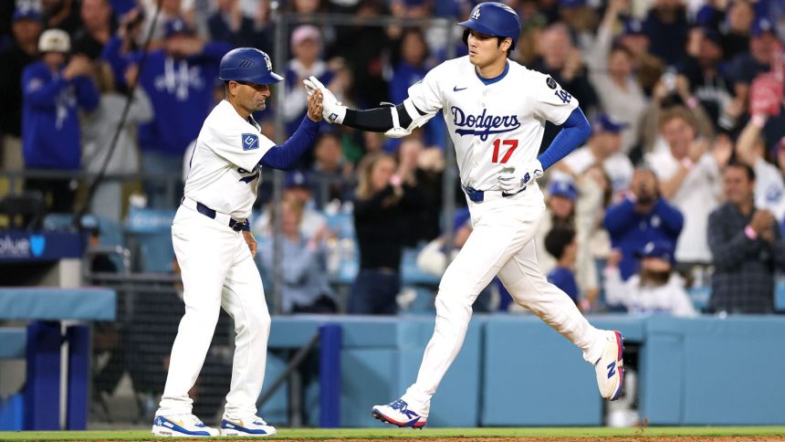 Shohei Ohtani of the Los Angeles Dodgers reacts after hitting a solo home run against the Arizona Diamondbacks during the sixth inning at Dodger Stadium on May 19.