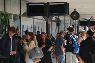 People waiting at a station after a significant power outage was reported by local authorities in Alpes-Maritimes in France on May 24, 2025.