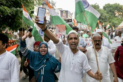 People carry India's national flag as they take par in Varanasi on May 24, 2025, to express solidarity with the country's armed forces after India and Pakistan agreed for a ceasefire following days of clashes