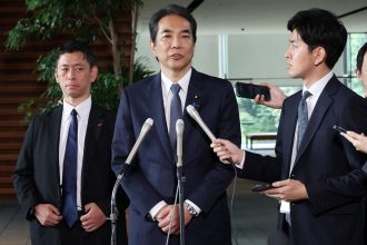 Agriculture Minister Taku Eto sparked outrage after telling reporters he had 'so much rice at home' that he could sell it