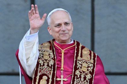 Pope Leo XIV waves to the crowd from the main central balcony of Saint John Lateran archbasilica after a holy mass in Rome, on May 25, 2025.
