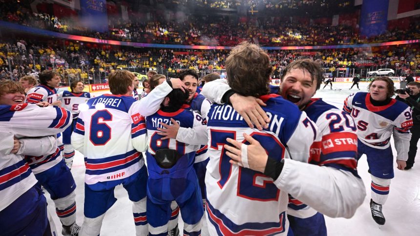 Team USA players celebrate after winning the IIHF World Championship against Switzerland in Stockholm, Sweden.