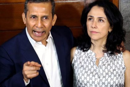 Peru's former President Ollanta Humala speaks next to his wife Nadine Heredia outside their home after being released from preventative detention awaiting trial on charges of money laundering, in Lima on April 30, 2018.