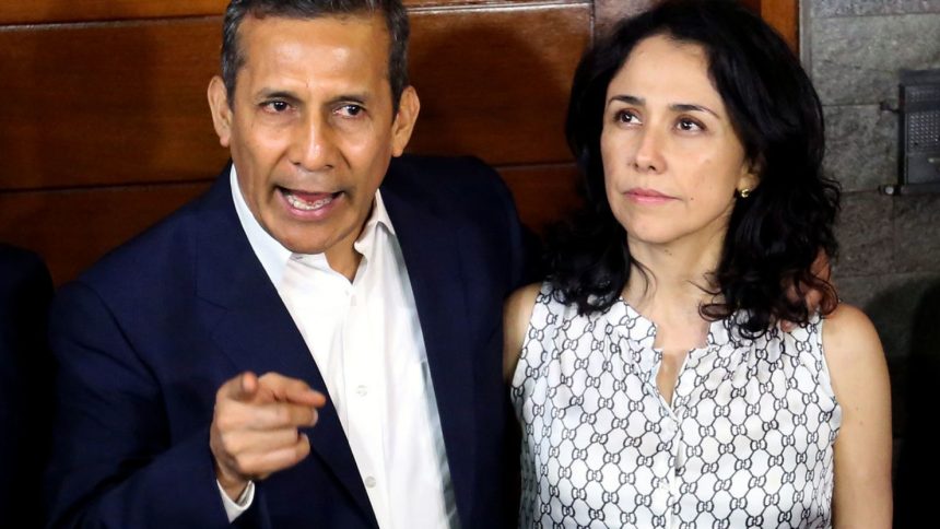 Peru's former President Ollanta Humala speaks next to his wife Nadine Heredia outside their home after being released from preventative detention awaiting trial on charges of money laundering, in Lima on April 30, 2018.