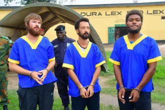 The Americans, pictured from left, Tyler Thompson, Benjamin Reuben Zalman-Polun and Marcel Malanga, were repatriated on Tuesday.