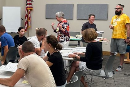 Iowa Newcomer Integration and Exchange (IA NICE) community volunteers provide free English lessons to Ukrainians at the DeWitt Community Library.