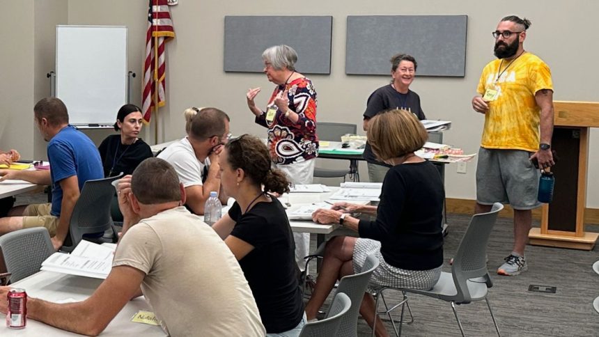 Iowa Newcomer Integration and Exchange (IA NICE) community volunteers provide free English lessons to Ukrainians at the DeWitt Community Library.