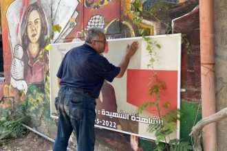 Ali Al-Samoudi outside the entrance of Jenin Camp, in Jenin, West Bank in 2022