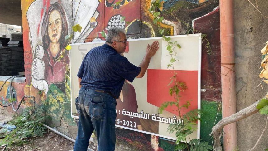 Ali Al-Samoudi outside the entrance of Jenin Camp, in Jenin, West Bank in 2022