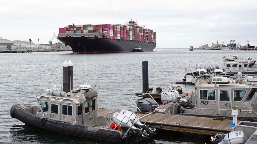 A cargo ship arriving at the Port of Los Angeles. Nearby are bonded warehouses where businesses pay money to have imports locked up to defer tariff payments.