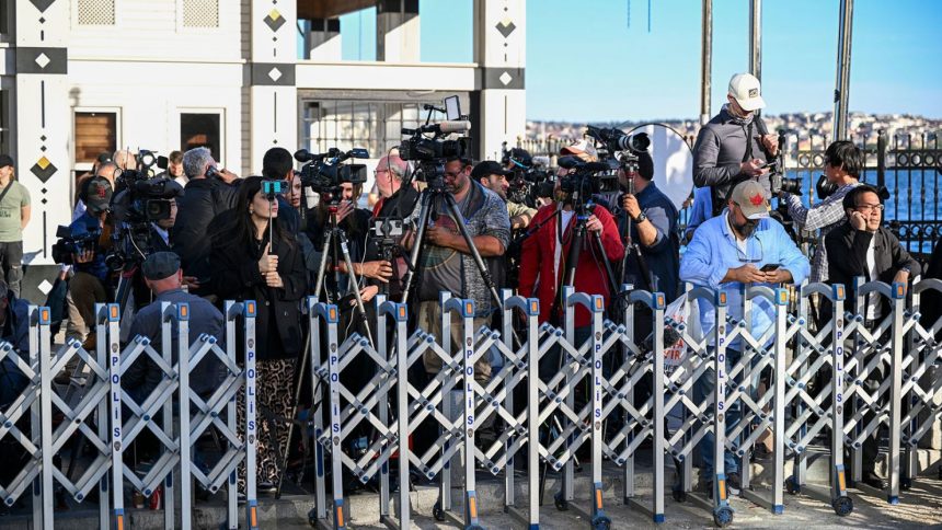 Members of the media gather outside the presidential office in Istanbul on Thursday.