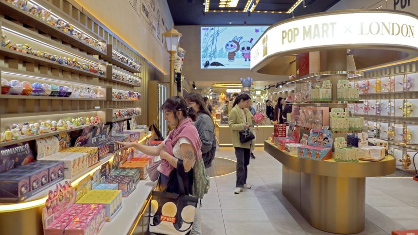 Customers purchase products at a Pop Mart store in London on May 21, 2025.
