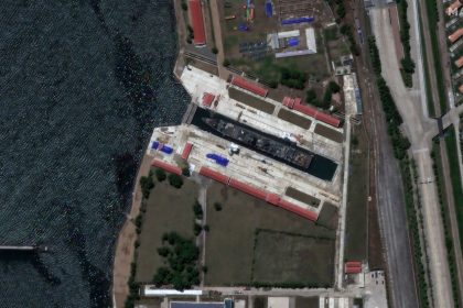 Satellite image showing a damaged North Korean destroyer at the Rajin repair facilities.