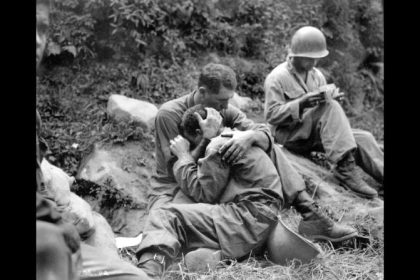 An American soldier comforts a comrade during the Korean War, circa 1950. Click through to see more scenes from the Korean War.