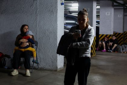 Residents take shelter inside an underground parking during Russian drone and missile strikes, amid Russia's attack on Ukraine, in Kyiv, Ukraine June 6, 2025