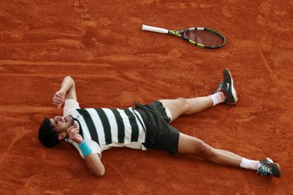 Carlos Alcaraz celebrates after winning the men's final at Roland Garros against Jannik Sinner.