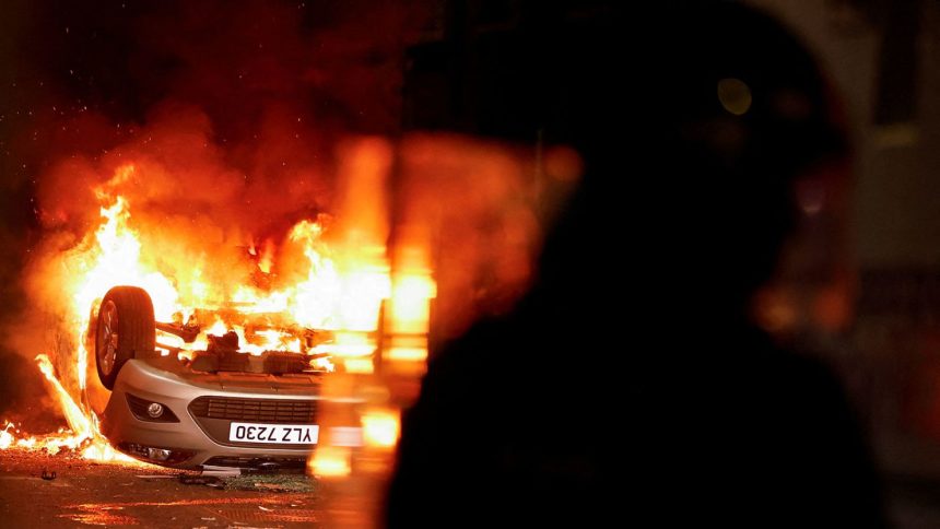 A vehicle burns during a second night of riots, in Ballymena, Northern Ireland, on June 11, 2025.