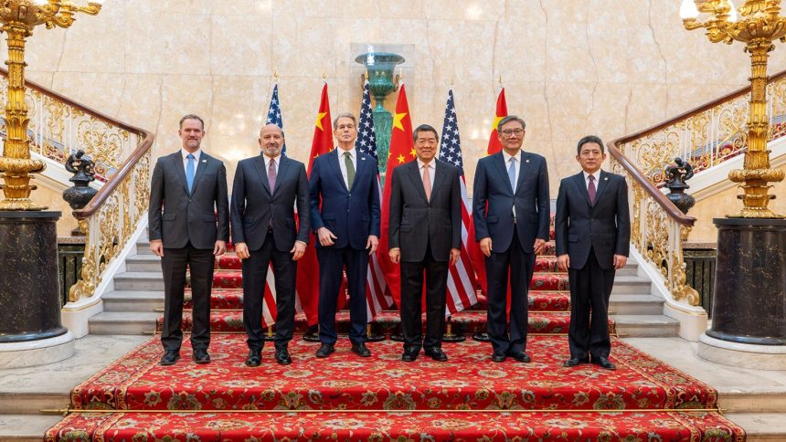 US and Chinese negotiators jointly pose for a photo during trade discussions at Lancaster House in London on June 9, 2025.
