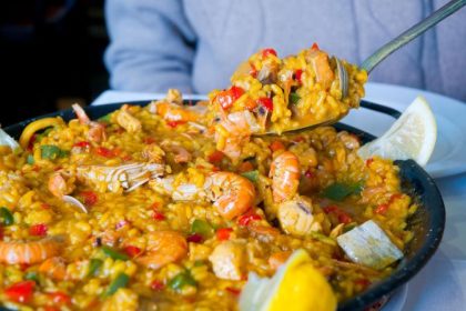 Paella: Originating in the region around Valencia, paella traditionally comes in two varieties: paella Valenciana (with rabbit and chicken) and seafood paella.