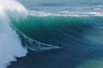 NAZARE, PORTUGAL - JANUARY 25: General view with people watching Laura Crane of Great Britian a wave during a surfing session at Praia do Norte on January 25, 2025 in Nazare, Portugal. (Photo by Stefan Matzke - sampics/Corbis via Getty Images)