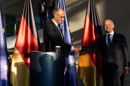BERLIN, GERMANY - MAY 06: Outgoing German Chancellor Olaf Scholz (R) congratulates new Chancellor Friedrich Merz of the German Christian Democrats (CDU) during a handover ceremony at the Chancellery following Merz’s election at a special session of the Bundestag on May 6, 2025 in Berlin, Germany. The new government is a coalition of Christian Democrats (CDU/CSU) and Social Democrats (SPD). (Photo by Maja Hitij/Getty Images)