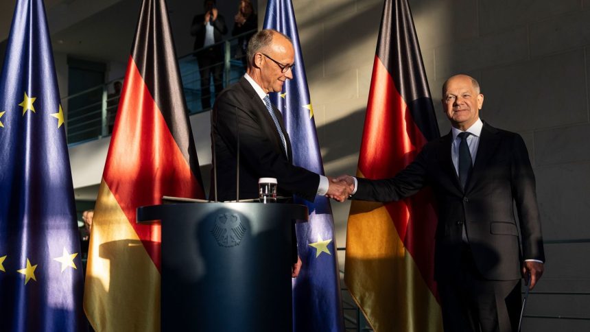 BERLIN, GERMANY - MAY 06: Outgoing German Chancellor Olaf Scholz (R) congratulates new Chancellor Friedrich Merz of the German Christian Democrats (CDU) during a handover ceremony at the Chancellery following Merz’s election at a special session of the Bundestag on May 6, 2025 in Berlin, Germany. The new government is a coalition of Christian Democrats (CDU/CSU) and Social Democrats (SPD). (Photo by Maja Hitij/Getty Images)