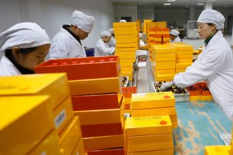 Employees work at a pharmaceutical production facility in Ji'an, Jiangxi province in southeast China, earlier this year.
