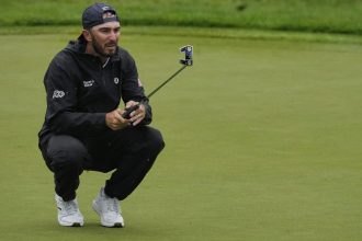 Max Homa lines up his putt on the 13th green during the second round of the Memorial golf tournament on Friday.