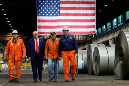President Donald Trump walks with workers as he tours U.S. Steel Corporation's Mon Valley Works-Irvin plant, Friday, May 30, 2025, in West Mifflin, Pennsylvania.