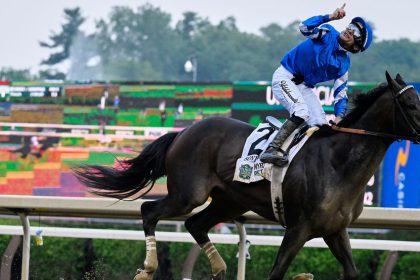 Jockey Junior Alvarado reacts atop Sovereignty as he crosses the finish line to win the 157th running of the Belmont Stakes.