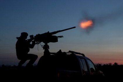 A Ukrainian Armed Forces serviceman fires a machine gun towards a Russian drone in the Kharkiv Region of Ukraine on June 2.