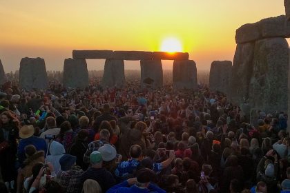 Throngs of visitors welcome the sun at Stonehenge during the summer solstice on June 21, 2023.