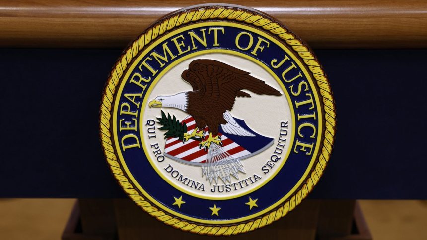 A seal for the Department of Justice is seen on a podium ahead of a news conference at the Department of Justice Building on March 21, 2024, in Washington, DC.