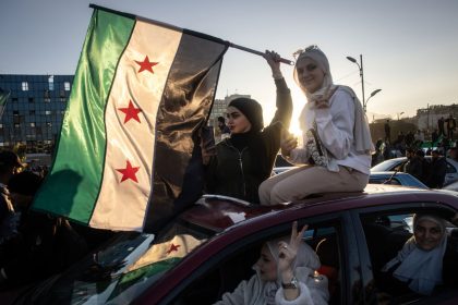 Women in Damascus, Syria, celebrate the fall of the Assad regime in December 2024.