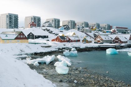 Painted houses and residential apartment blocks overlook the fjord in Nuuk, Greenland, on April 3.