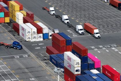 In an aerial view, shipping containers are stacked at the Port of Oakland on April 02, 2025 in Oakland, California.