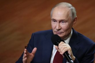 Russian President Vladimir Putin gestures as he speaks during a meeting in Sirius, Russia, on May 19.