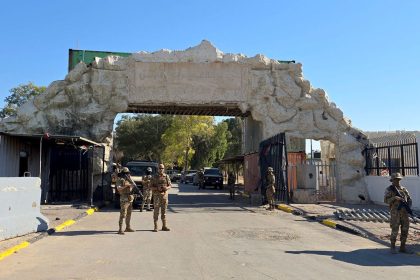 Libyan security forces stand guard at the entrance of Tripoli Zoo on May 28, 2025.