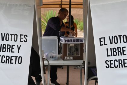 A voter casts his ballot at a ''special'' ballot box zone installed for people living outside the border city of Tijuana on June 1, 2025.
