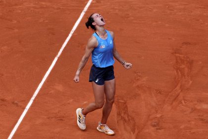 Lois Boisson celebrates her comeback win against world No. 3 Jessica Pegula in the round of 16 at Roland Garros.