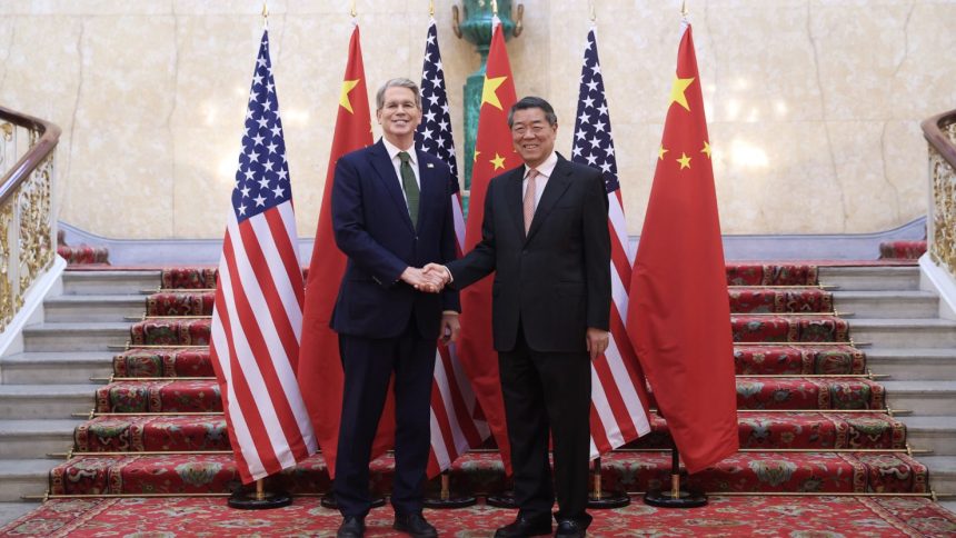 Chinese Vice Premier He Lifeng shakes hands with US Treasury Secretary Scott Bessent in London on Monday.