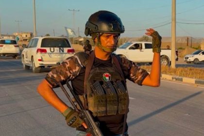 Yasser Abu Shabab can be seen holding a gun in this image posted on the Popular Forces’ Facebook page.