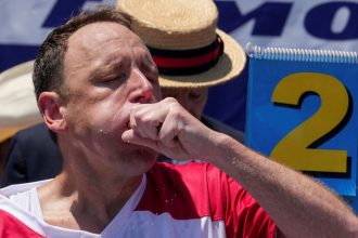 Joey Chestnut, a multi-time winner, competes during the 2025 Nathan's Famous International Hot Dog Eating Contest, at Coney Island, Brooklyn in New York City, U.S., July 4, 2025. REUTERS/David 'Dee' Delgado