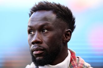 MANCHESTER, ENGLAND - APRIL 26: Former Manchester City and Arsenal player Bacary Sagna working for BT Sport Television as a pundit during the Premier League match between Manchester City and Arsenal FC at Etihad Stadium on April 26, 2023 in Manchester, United Kingdom.